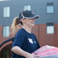 GVSU alumna carries clear bin in front of Holten Hooker dorm